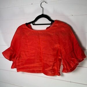 Karlie red/orange crop top small very cute w/ ruffle sleeves 
Karlie. A186